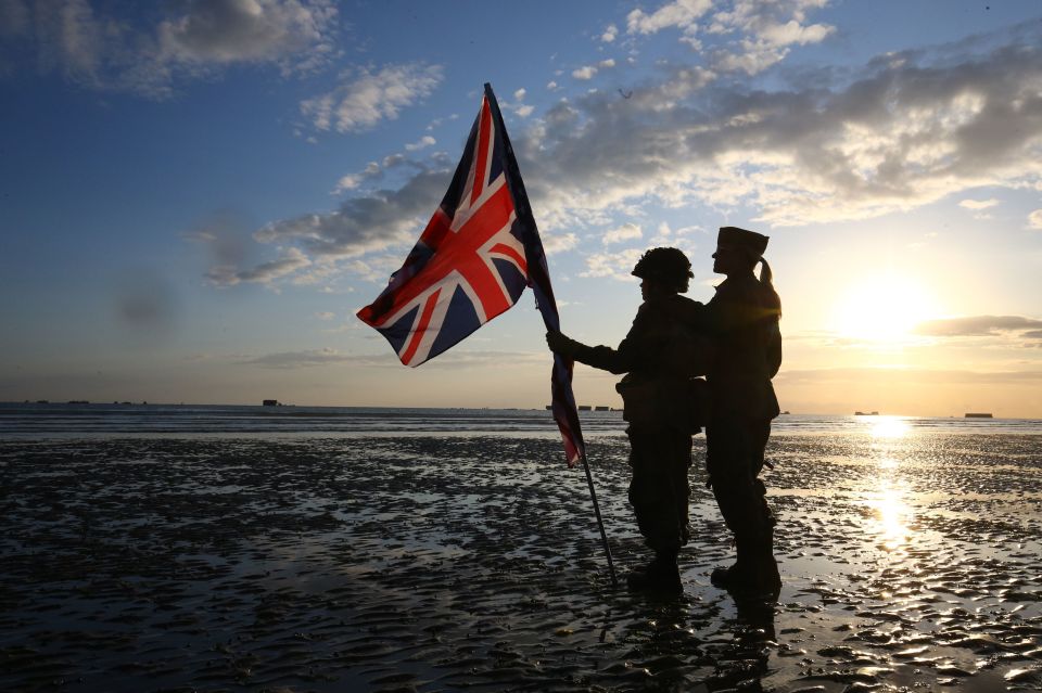  Thousands gathered on the beaches of Normandy today to pay their respects - including veterans of the Second World War and military reenactor