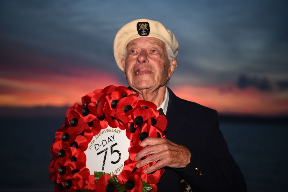  Len Perry, 95, from London, holds a D-Day 75 wreath while sailing on the MV Boudicca from Portsmouth to Normandy for the commemorations