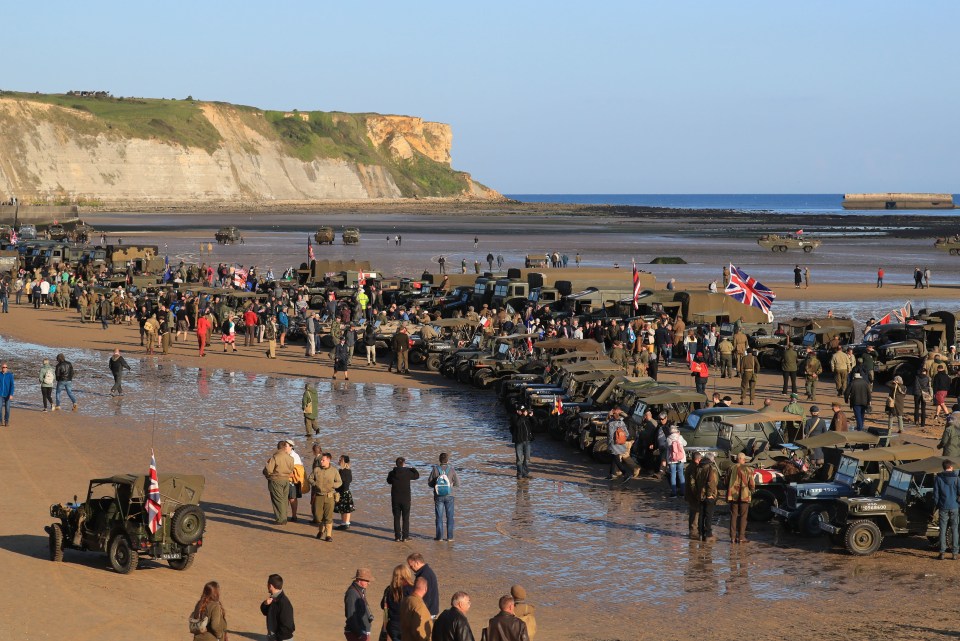 Military vehicles line the beach at Arromanches in Normandy for the anniversary