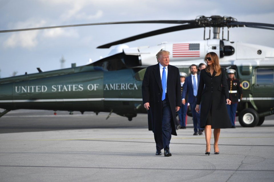 US President Donald Trump and First Lady Melania Trump make their way to board Air Force One at Shannon Airport in Shannon, Ireland, to fly to Normandy for the commemorations