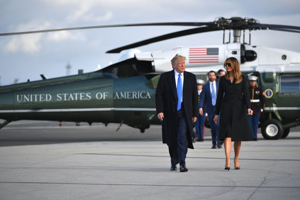  US President Donald Trump and First Lady Melania Trump make their way to board Air Force One at Shannon Airport in Shannon, Ireland, to fly to Normandy for the commemorations