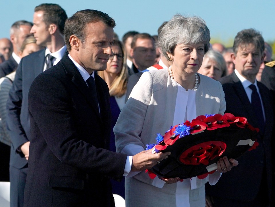 French President Emmanuel Macron and Prime Minister Theresa May lay a wreath together at the Inauguration of the British Normandy Memorial site in Ver-sur-Mer