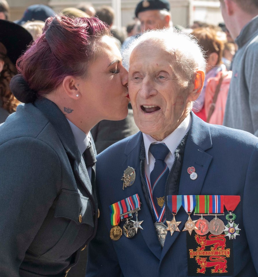 D-Day veteran Ernie Corill, 94, gets a kiss from Rachel Green, 36, from Barnsley