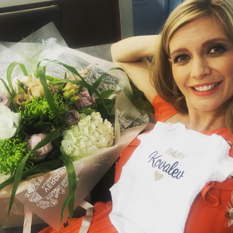  Rachel Riley with flowers for her and a baby grow for 'baby Kovalev'