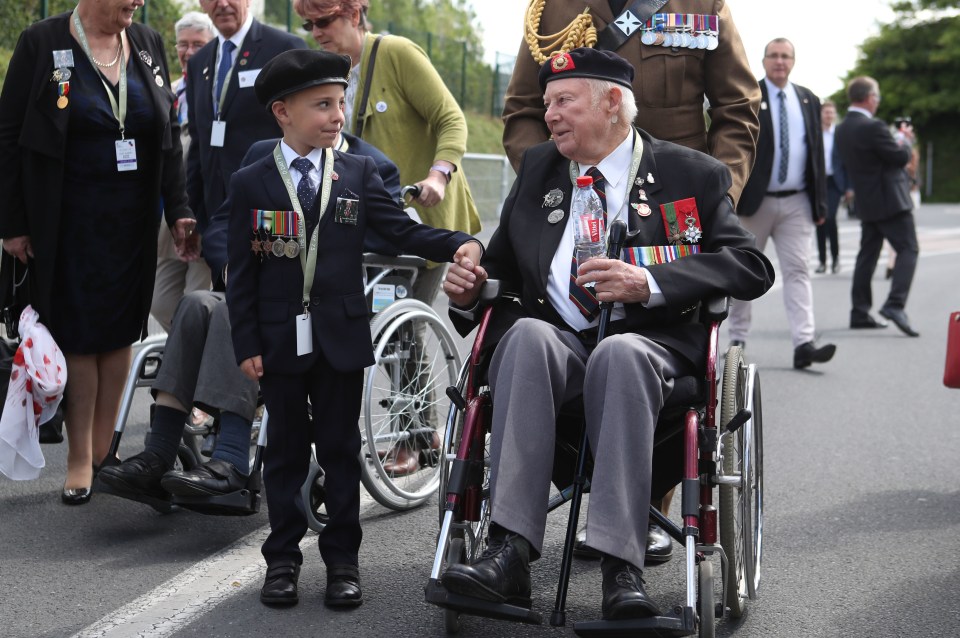 D-Day veteran John Quinn meets George Sayer, 6, in Bayeaux