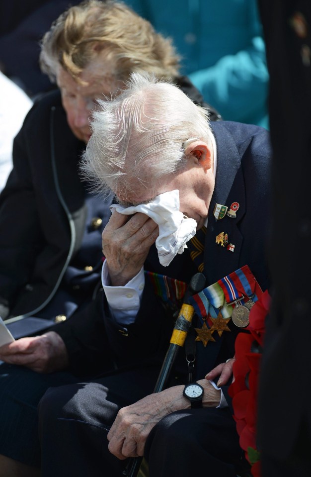 Veteran James Ockendon dries his eyes during the service at the D-Day Stone on the Southsea Esplanade in Portsmouth this morning