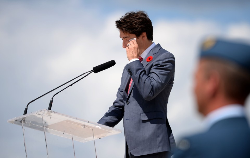 Canadian Prime Minister Justin Trudeau wipes a tear as he delivers a speech during the international ceremony on Juno Beach in Courseulles-sur-Mer, Normandy