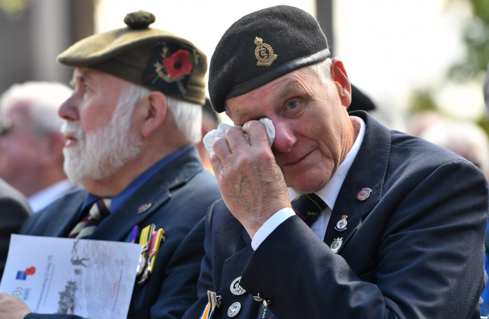 A veteran weeps at a commemoration service at The National Memorial Arboretum in Alrewas, Staffordshire