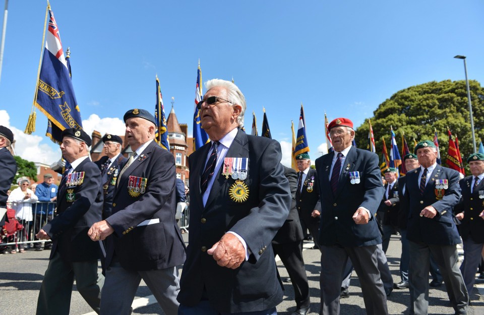 Veterans marching towards the D-Day Stone before the service in Southsea this morning