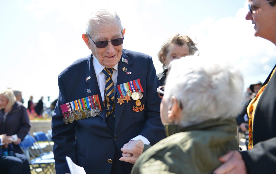 Veteran James Ockendon greets a friend after the service in Portsmouth