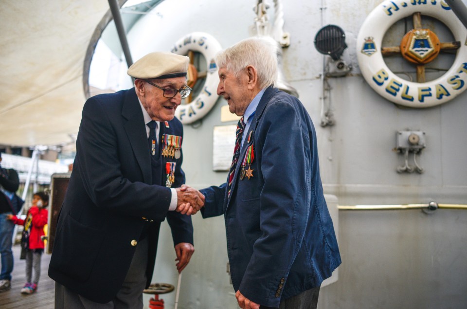 Veterans John Connelly and Nev Lees on board HMS Belfast in London