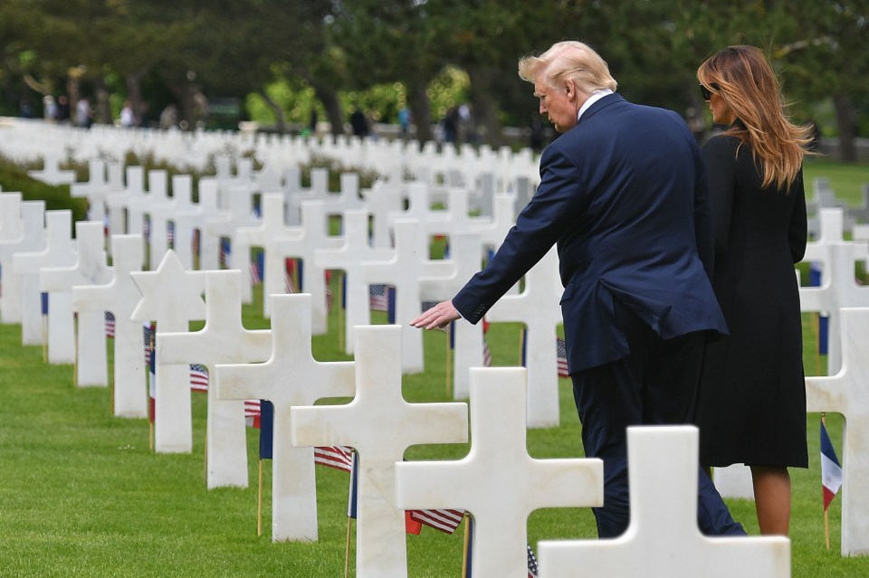 Donald Trump and his wife Melania visit graves after the Normandy service