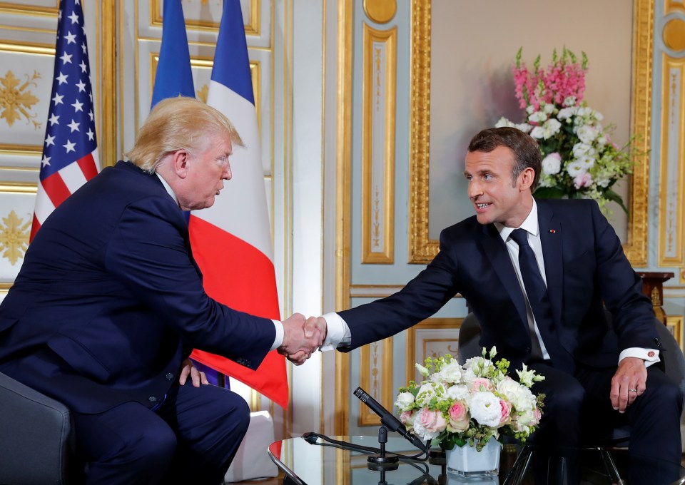  The French leader, known for his enthusiastic handshakes, appeared to grip the hand of the US President very tightly