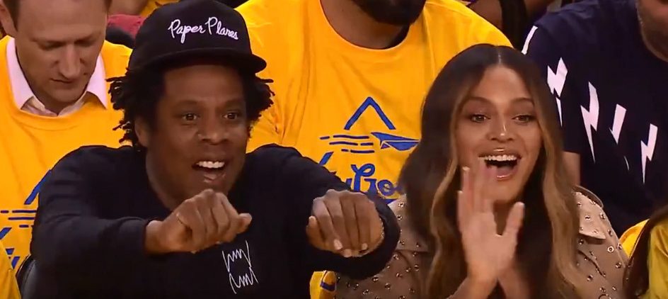  Jay and Bey were initially all smiles while sitting courtside...