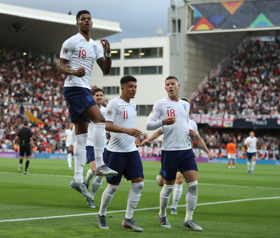  Marcus Rashford jumps for joy after scoring from the spot to put England 1-0 up