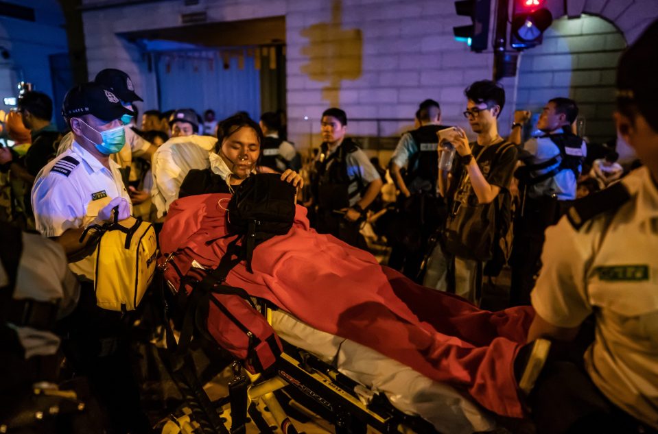  A protester is taken away on a stretcher after being injured in clashes with police