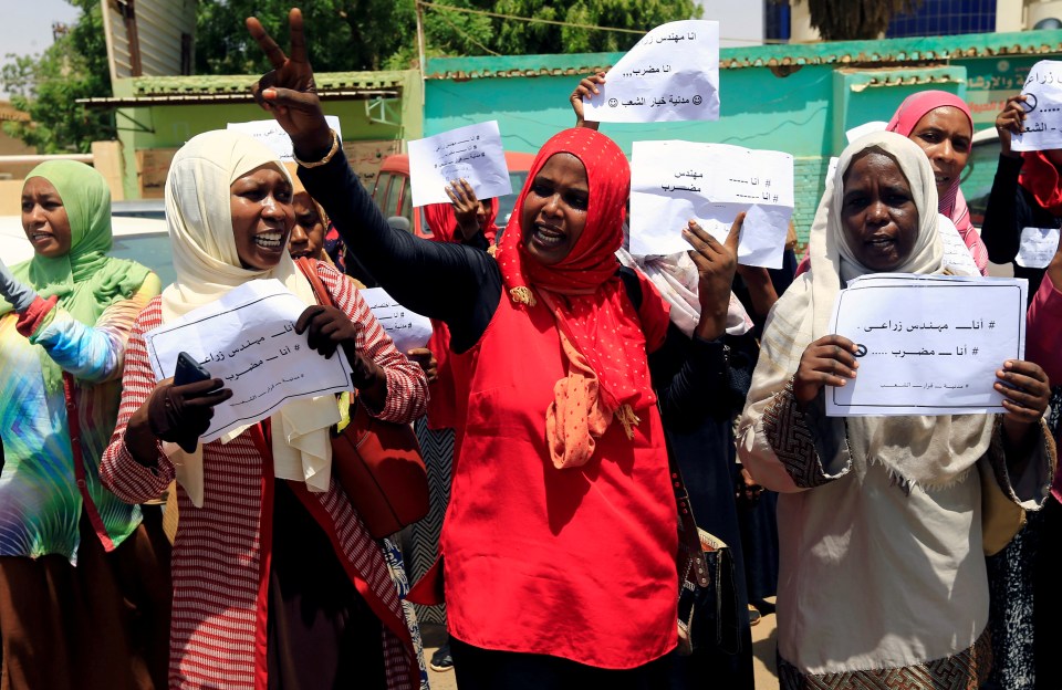  Members of Sudan's alliance of opposition and protest groups chant slogans outside Sudan's Central Bank