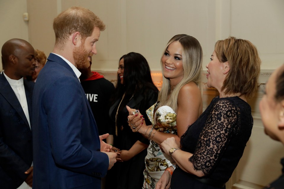  Prince Harry jokes with Rita Ora, centre, during an event on Tuesday for his Sentebale charity