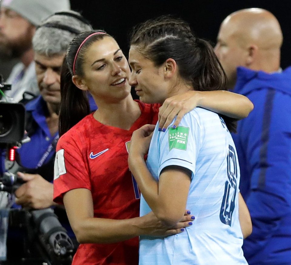  Alex Morgan comforts Suchawadee Nildhamrong who was struggling to cope with the humiliating defeat