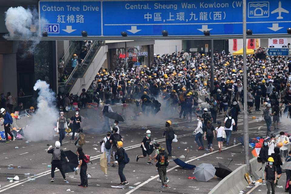  Black-clad demonstrators have brought the heart of the city to a standstill by flooding into major arteries of the city