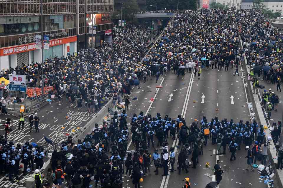  A procession of people almost two miles long marched for seven hours through central Hong Kong on Sunday