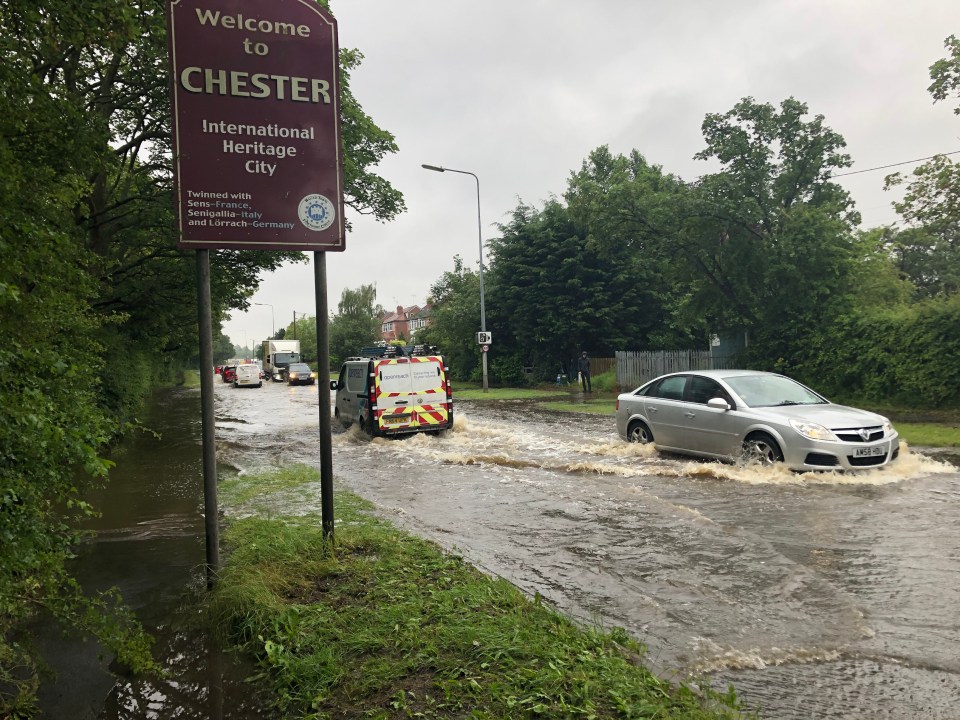 Chester drivers tackle floodwaters after heavy rain today