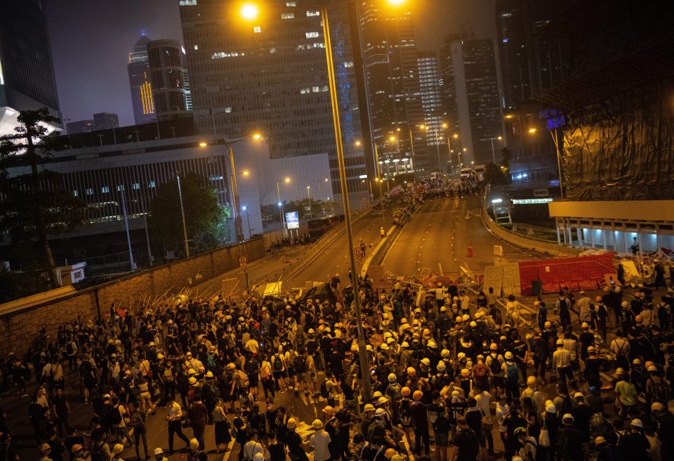  Violence broke out after police equipped with riot gear, batons, and pepper spray, moved on peaceful protesters outside the parliament and government headquarters