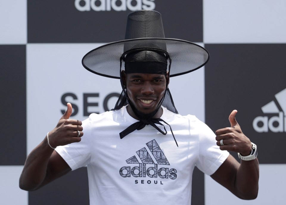 Paul Pogba posed in a traditional hat during an promotional tour in South Korea