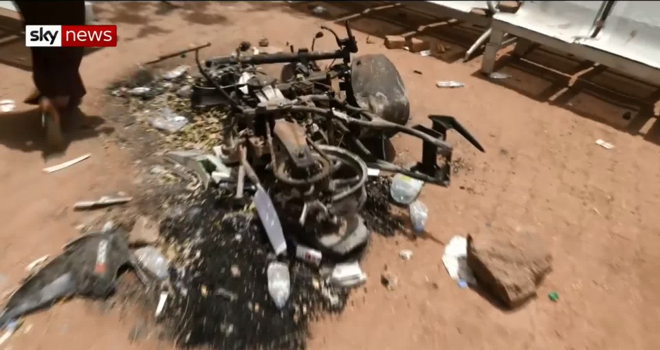  Debris outside a school from which the stench of dead bodies emanated