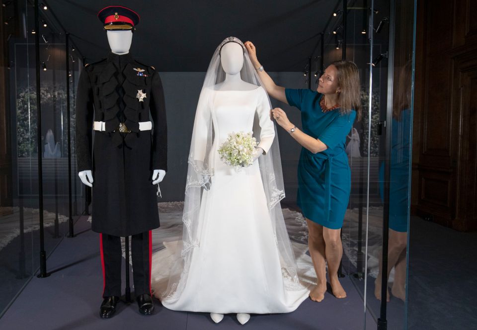  The couple's wedding ensembles are on display at Holyroodhouse in Scotland until October