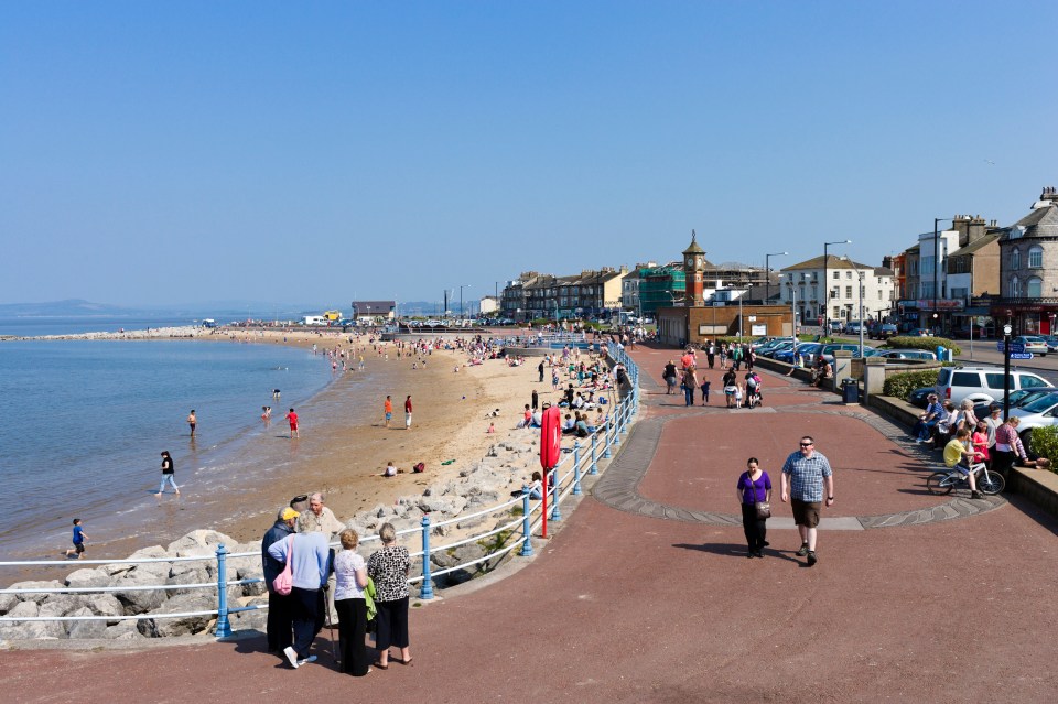  Seafront promenade and beach in the seaside resort of Morecambe in summer