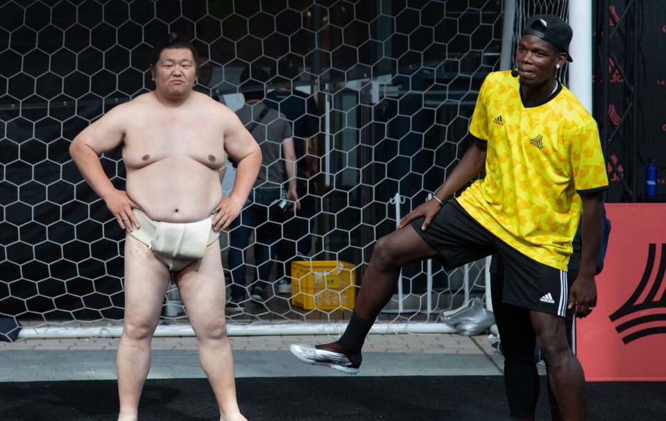  Paul Pogba tries his hand at the Sumo stance