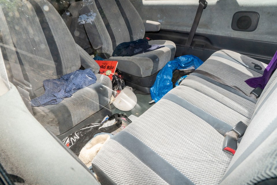  A discarded blue top, Sports Direct bag for life, Ikea bag and cartoon books make for an unsightly interior