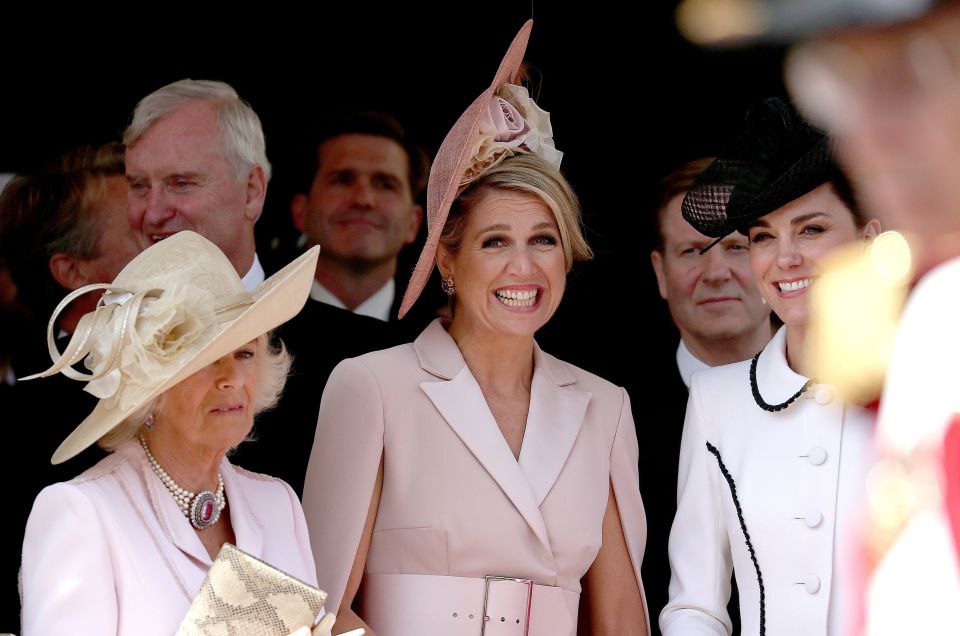  Kate smiles with Camilla and Queen Maxima