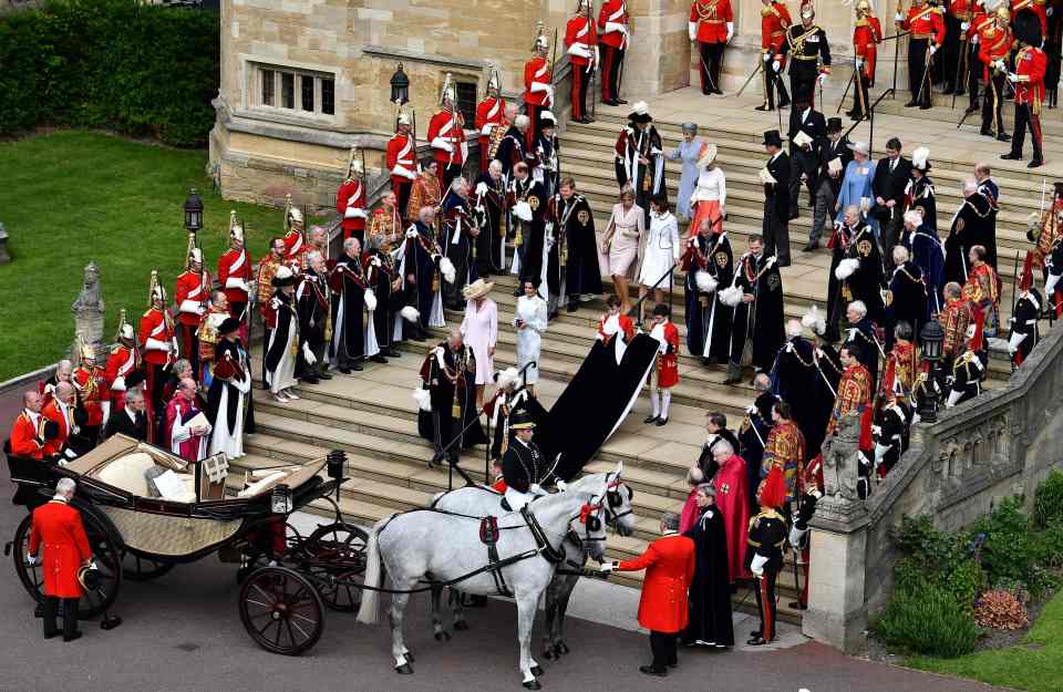  The Queen leaving the service with senior members of the royal family behind her