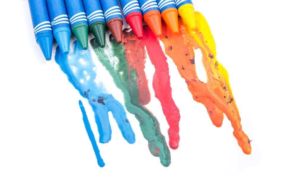  If you're struggling to scrub out melted crayons, run an iron over wax paper and see it lift off