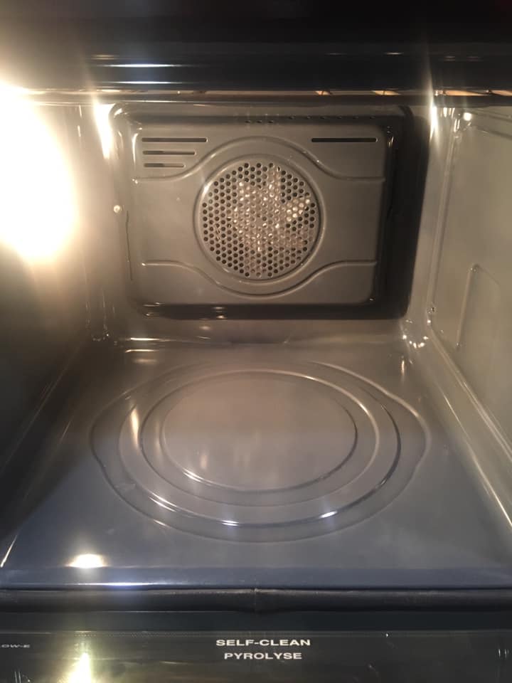 After she had pressed the button, the oven ended up turning all the grease to ash and she could quickly wipe away to look clean