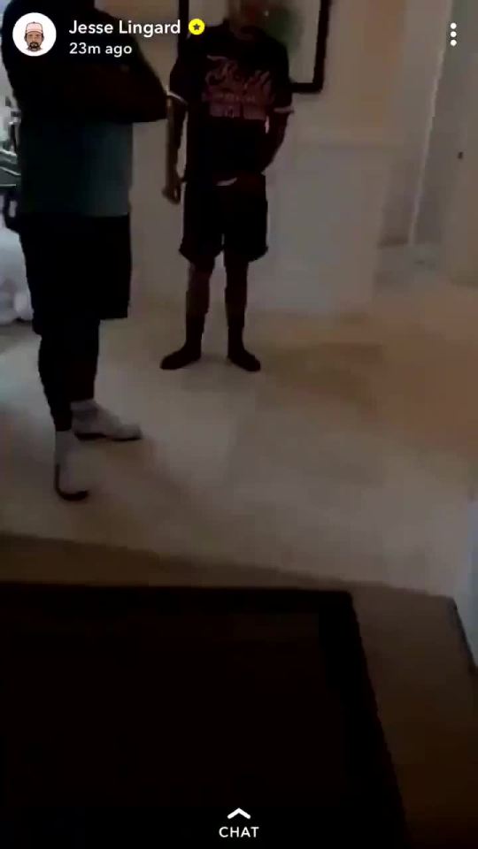  Jesse Lingard's friends stand by in the corridor as he films a tour of their hotel rooms