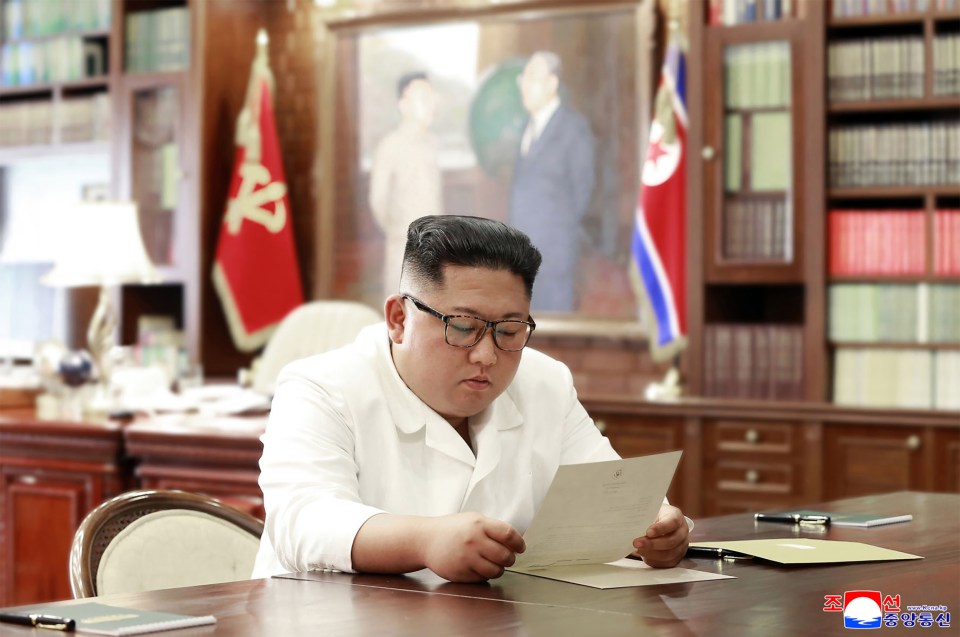  North Korean state news released this image of Kim Jong-un reading a letter sent by US President Donald Trump