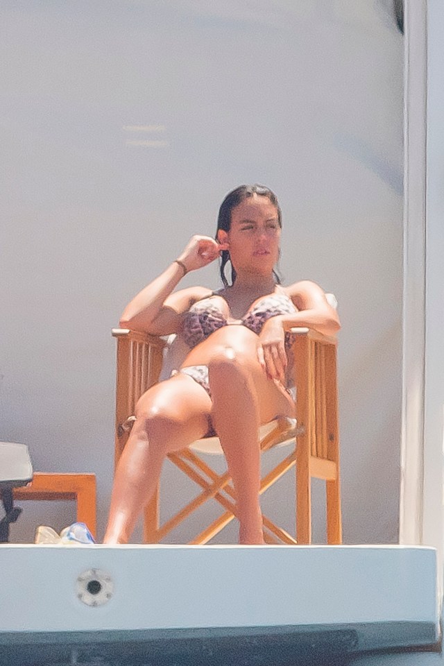 Rodriguez relaxes on the back of the boat which is anchored in the French Riviera 