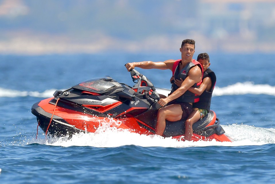 Ronaldo and Cristiano Jr jumped on board a jet-ski and whizzed around the water