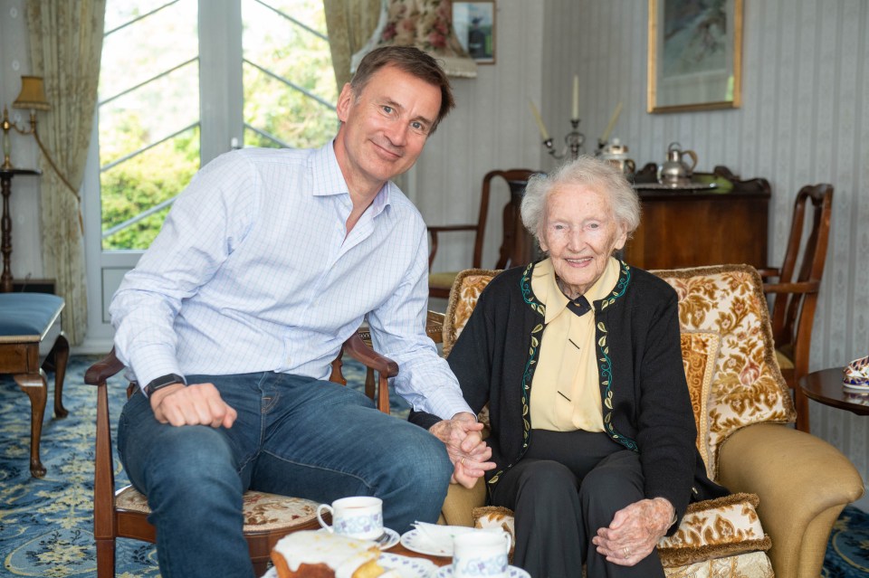 Jeremy Hunt – seen here with his 99-year-old great aunt Bettie – attacked Boris today for running away from debates