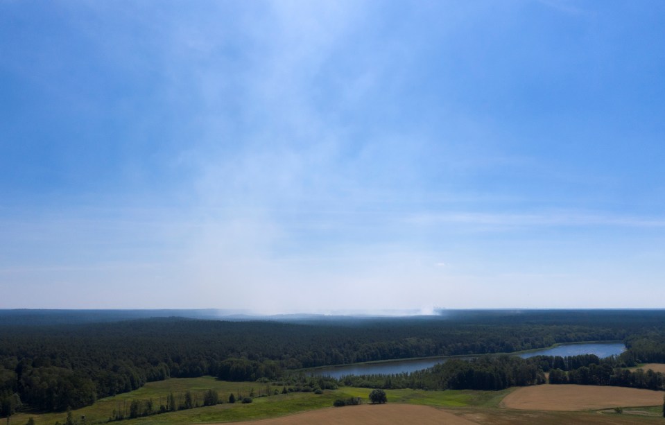  Smoke rises from a forest fire near Lieberoser Heide in eastern Germany today