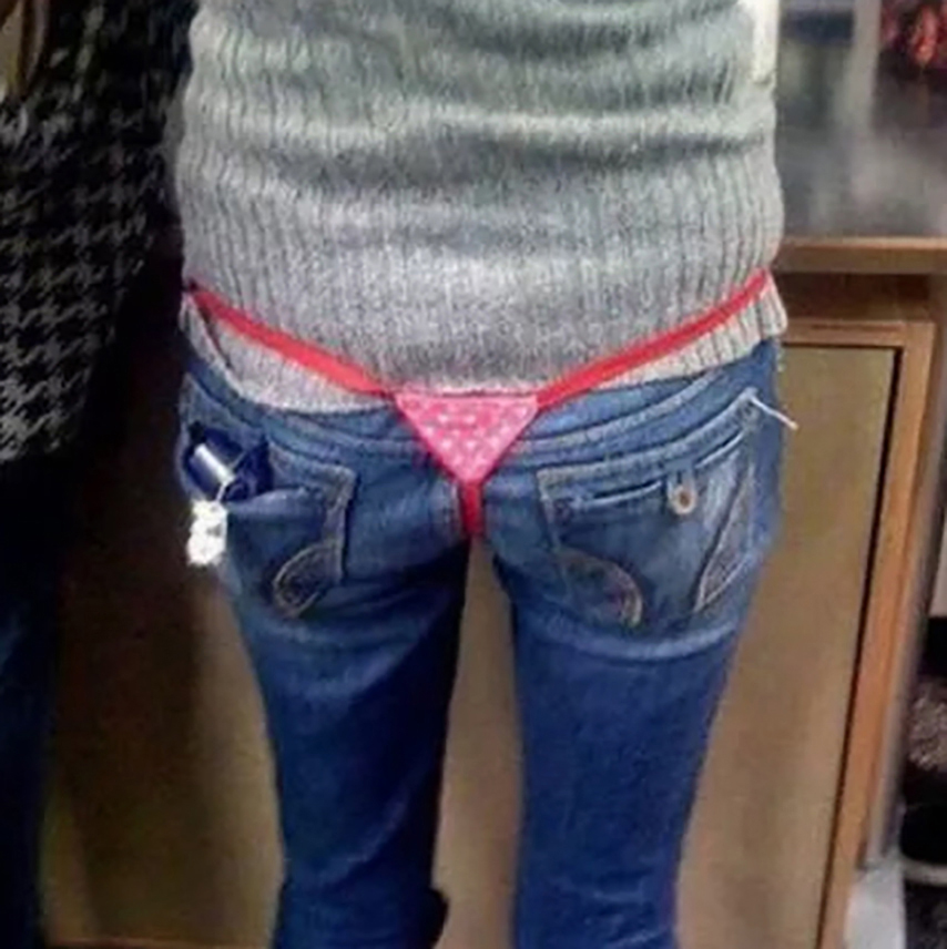 Someone needs to tell this bloke that thongs are normally worn UNDER jeans