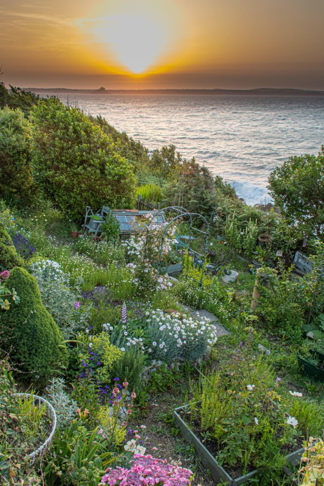  The sun breaking through the horizon in Mousehole, Cornwall this morning