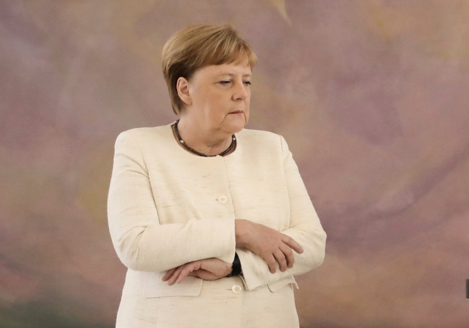 Angela Merkel seen shaking again today at a ceremony in Berlin