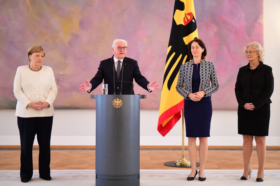 The chancellor stood alongside Germany's president at an event to swear in the new justice minister