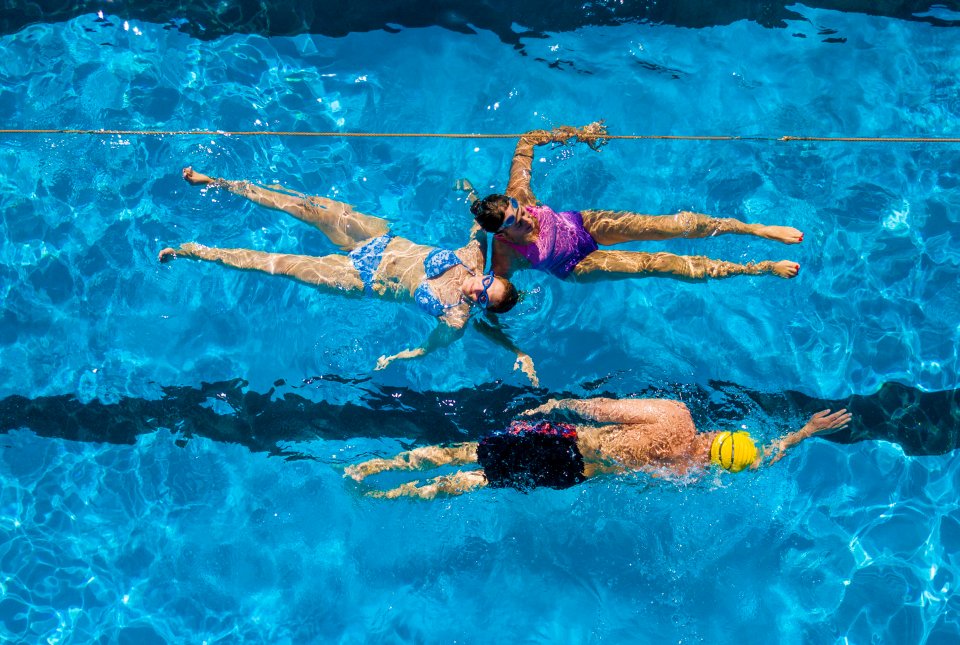  Swimmers enjoying an open air swim as temperatures will get up to 28C across the UK