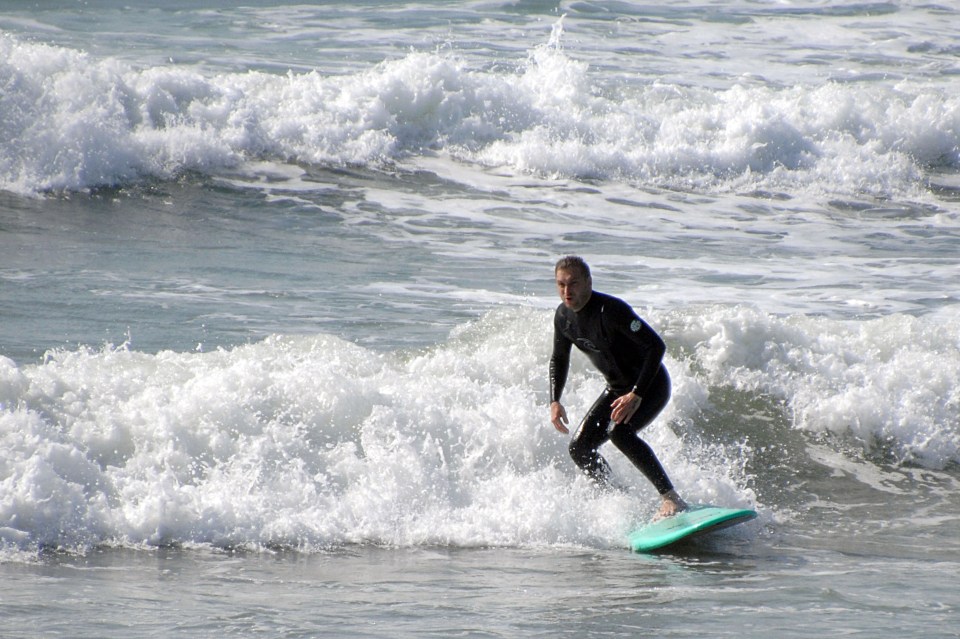  This man took to Weymouth to ride some waves as today is set to reach 28C