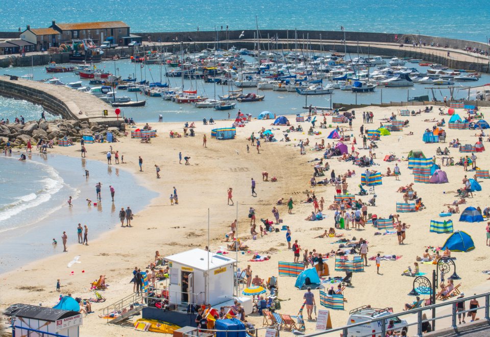  Brits dash to Lyme Regis in Dorset to catch some sunshine